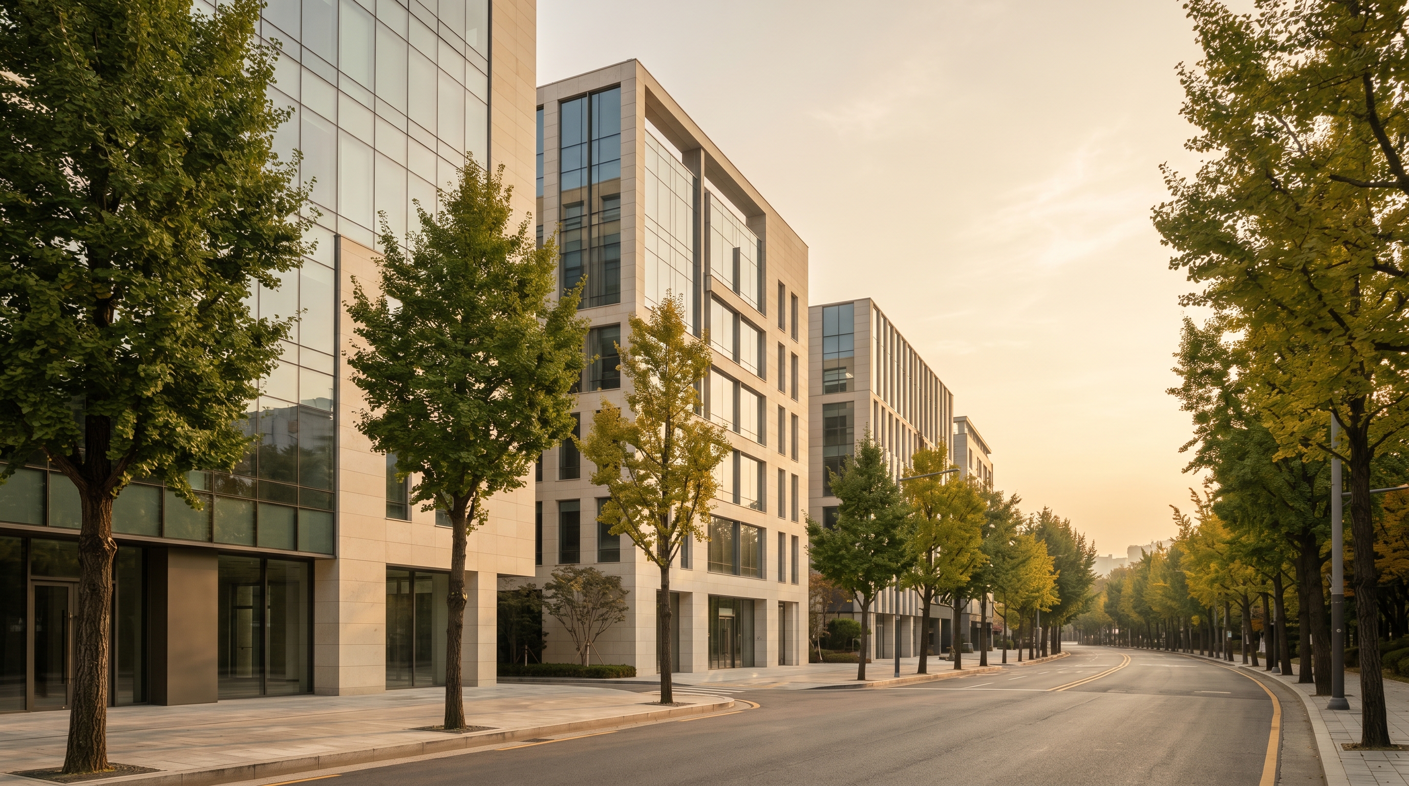 Quiet contemporary Seoul streetscape at golden hour, cream-stone facades stretching down a tree-lined avenue, visual metaphor for the three aesthetic districts